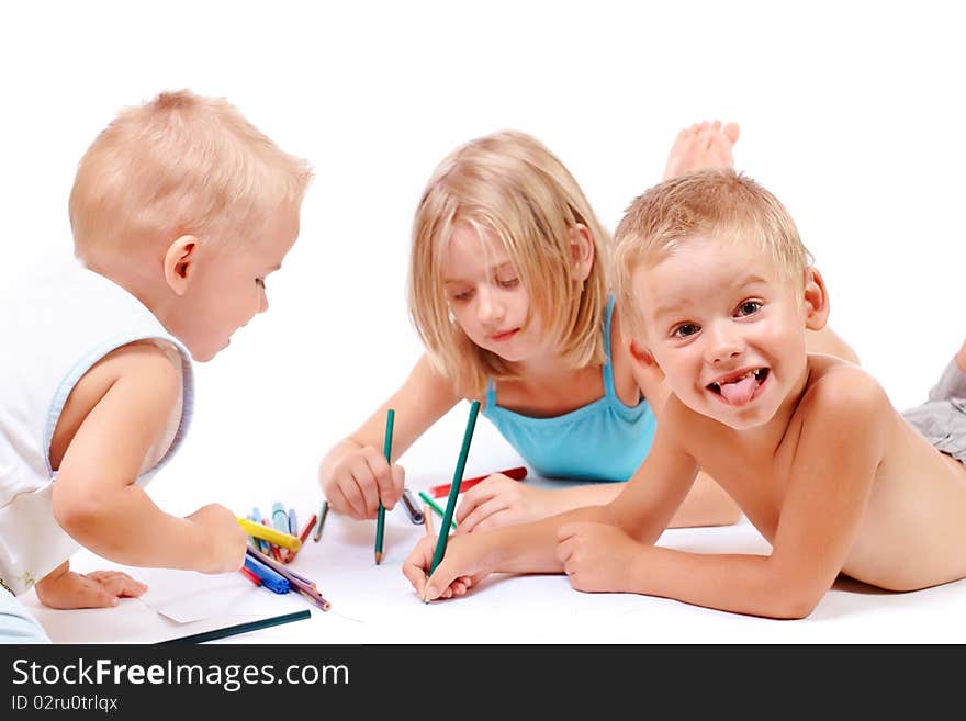 A group of children drawing on paper