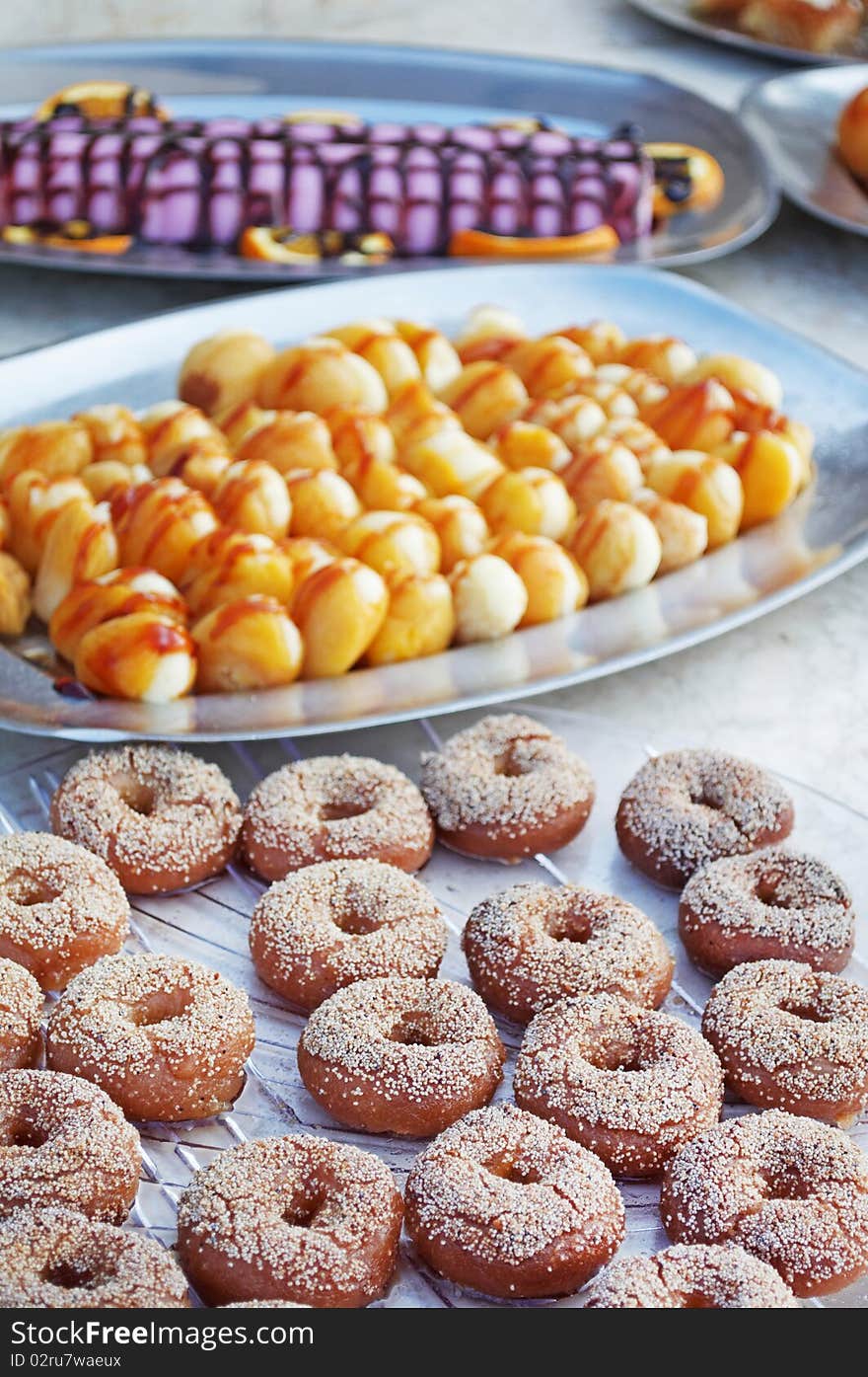 Chocolate doughnut-shaped bread rolls and dried apricots