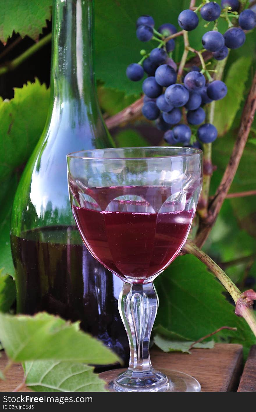 Wine against a background of grapes. Wine against a background of grapes