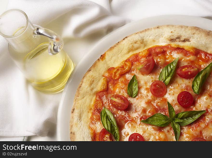 Still life with pizza and basil and cheese