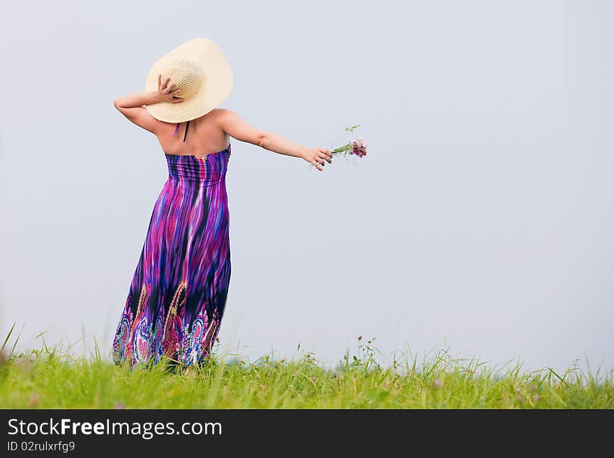 Young beautiful girl on a meadow