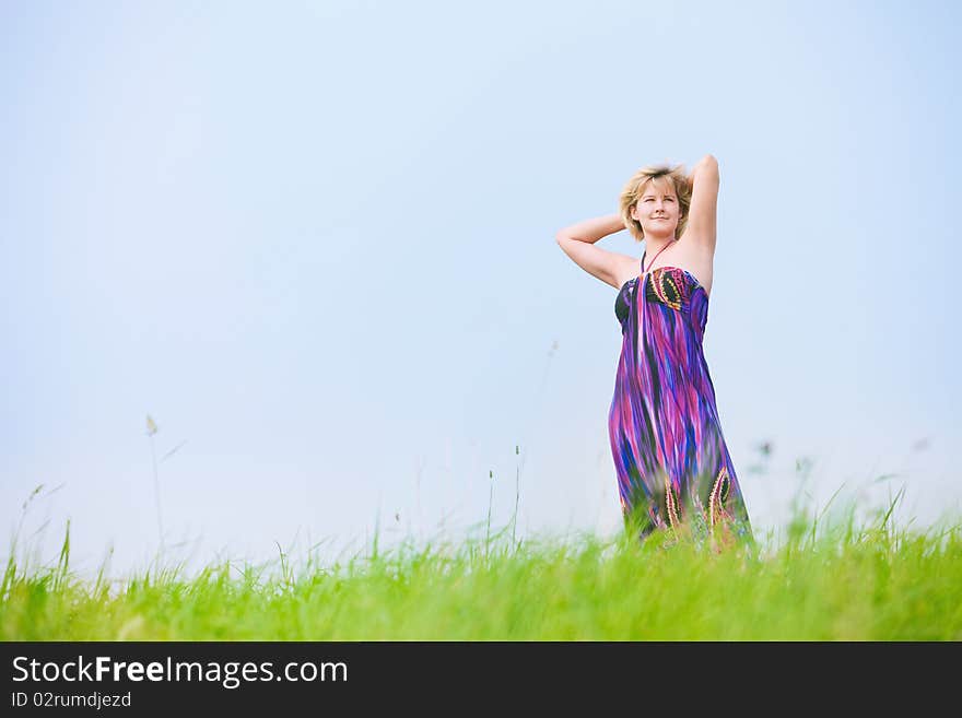 Young beautiful girl on a meadow