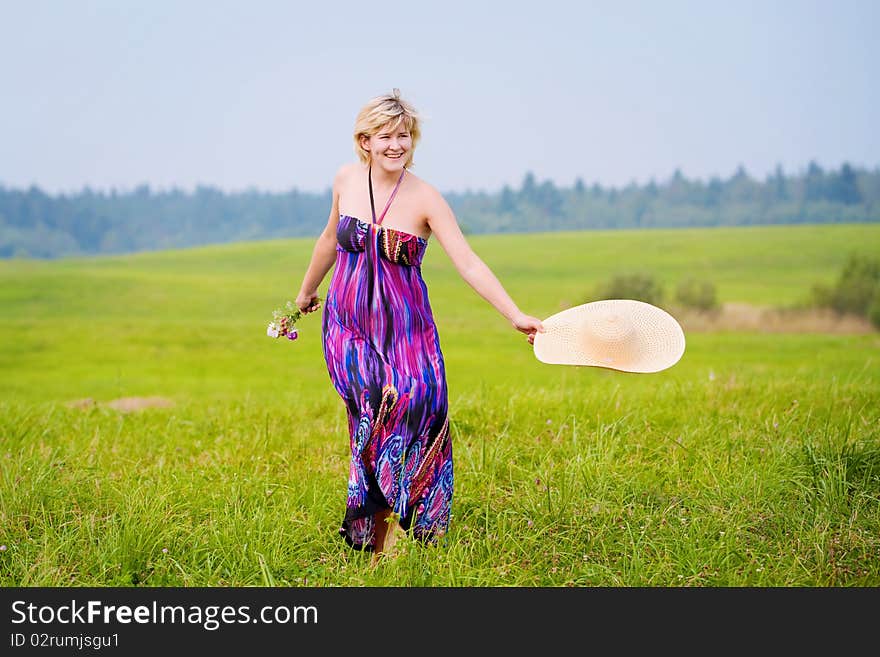 Young beautiful girl on a meadow