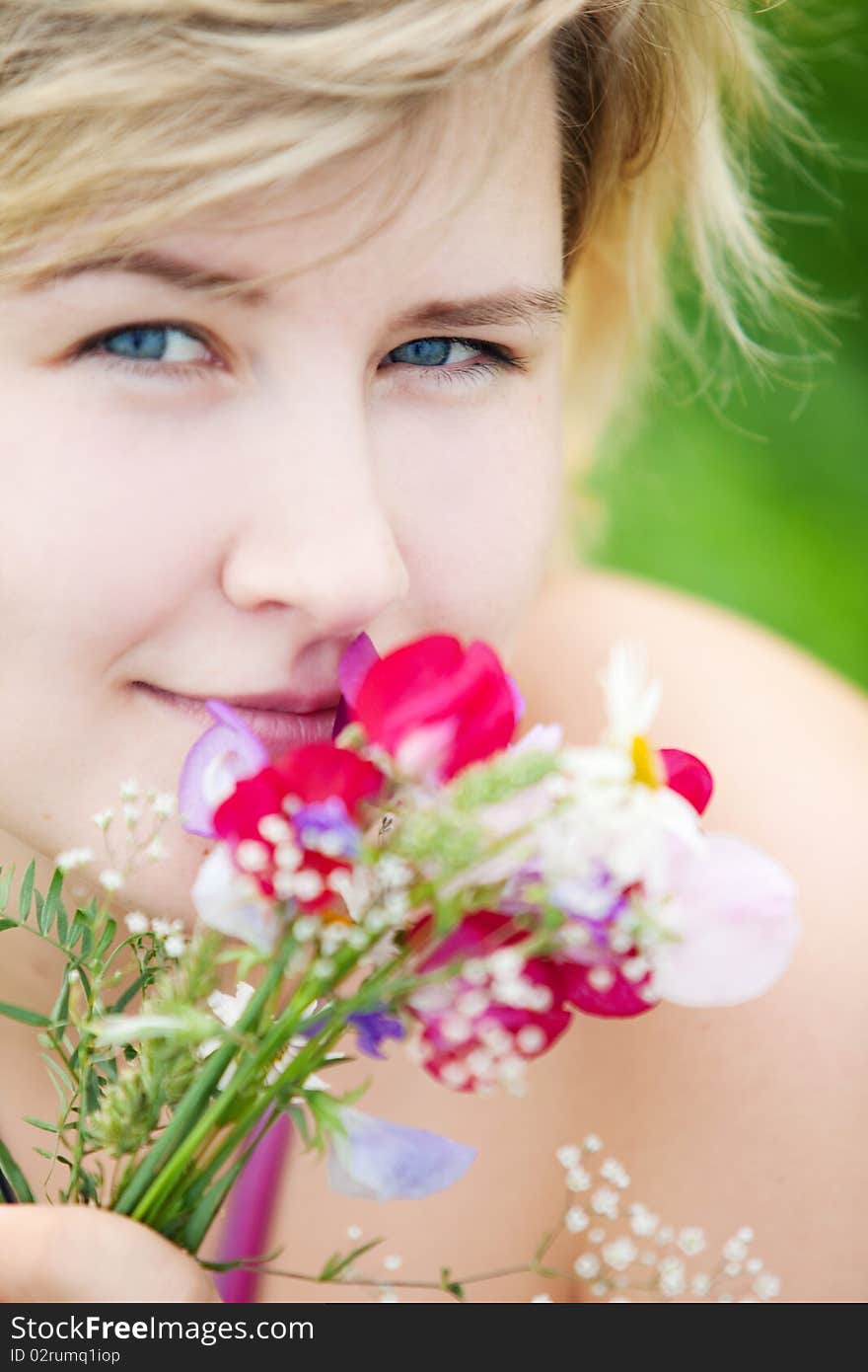 Young beautiful girl on a meadow