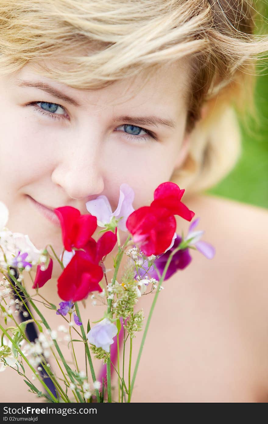 Young beautiful girl on a meadow