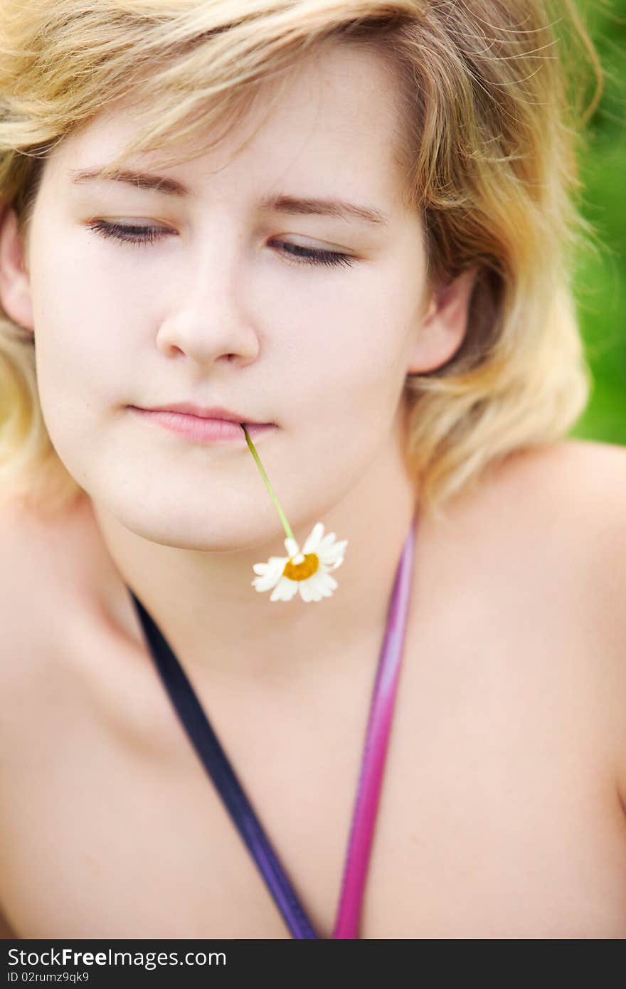 Young beautiful girl on a meadow