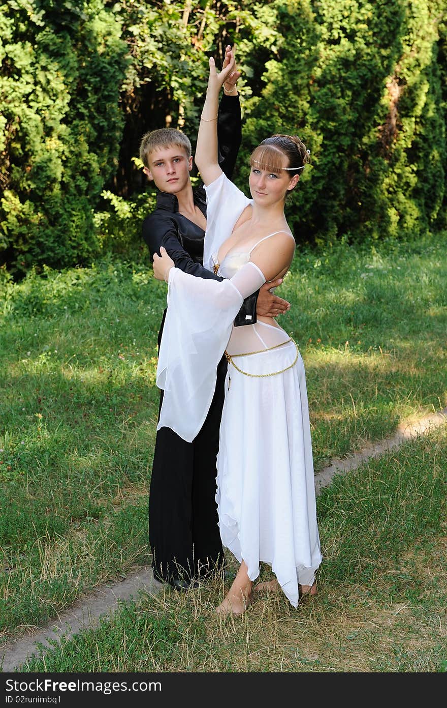 Dancing couple outdoors in park