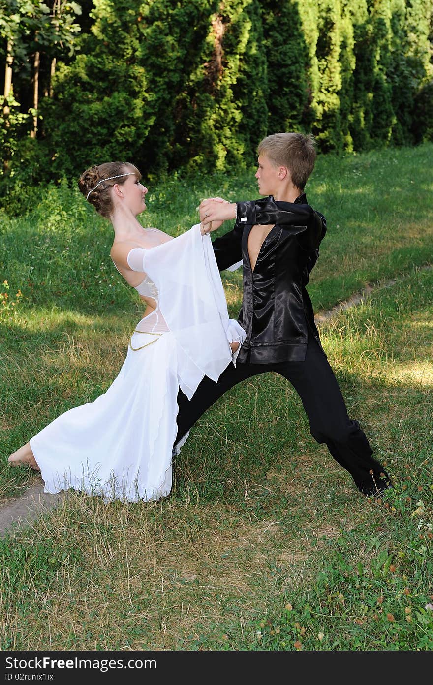 Dancing couple outdoors in park