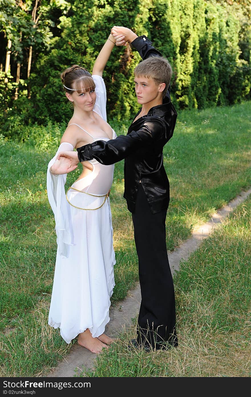 Dancing couple outdoors in park