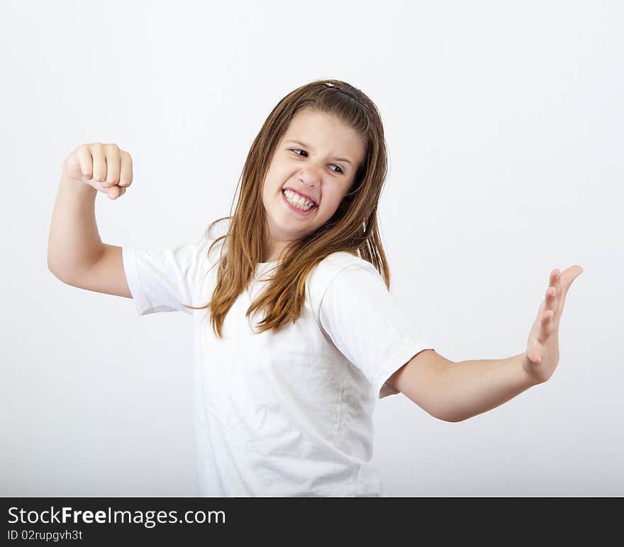 Angry girl prepares to strike open hand with clenched fist. Angry girl prepares to strike open hand with clenched fist.