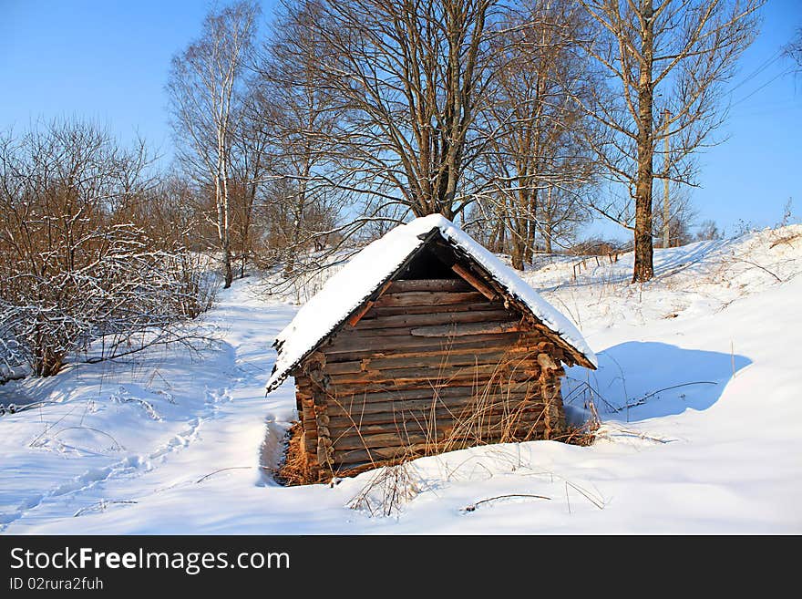 Old rural house amongst snow