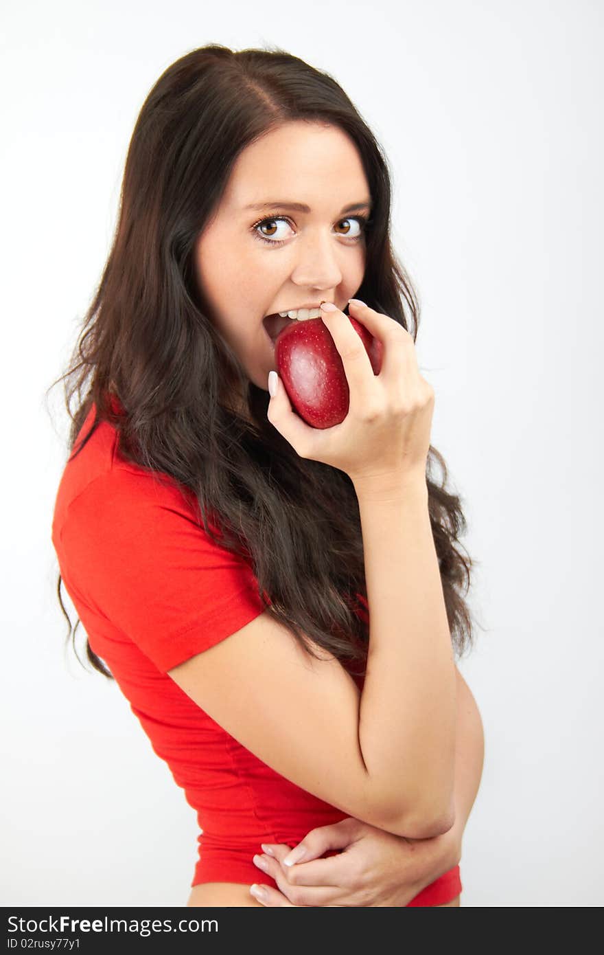 Smiling woman with an apple