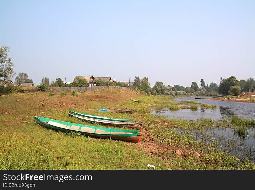 Boats On Coast River