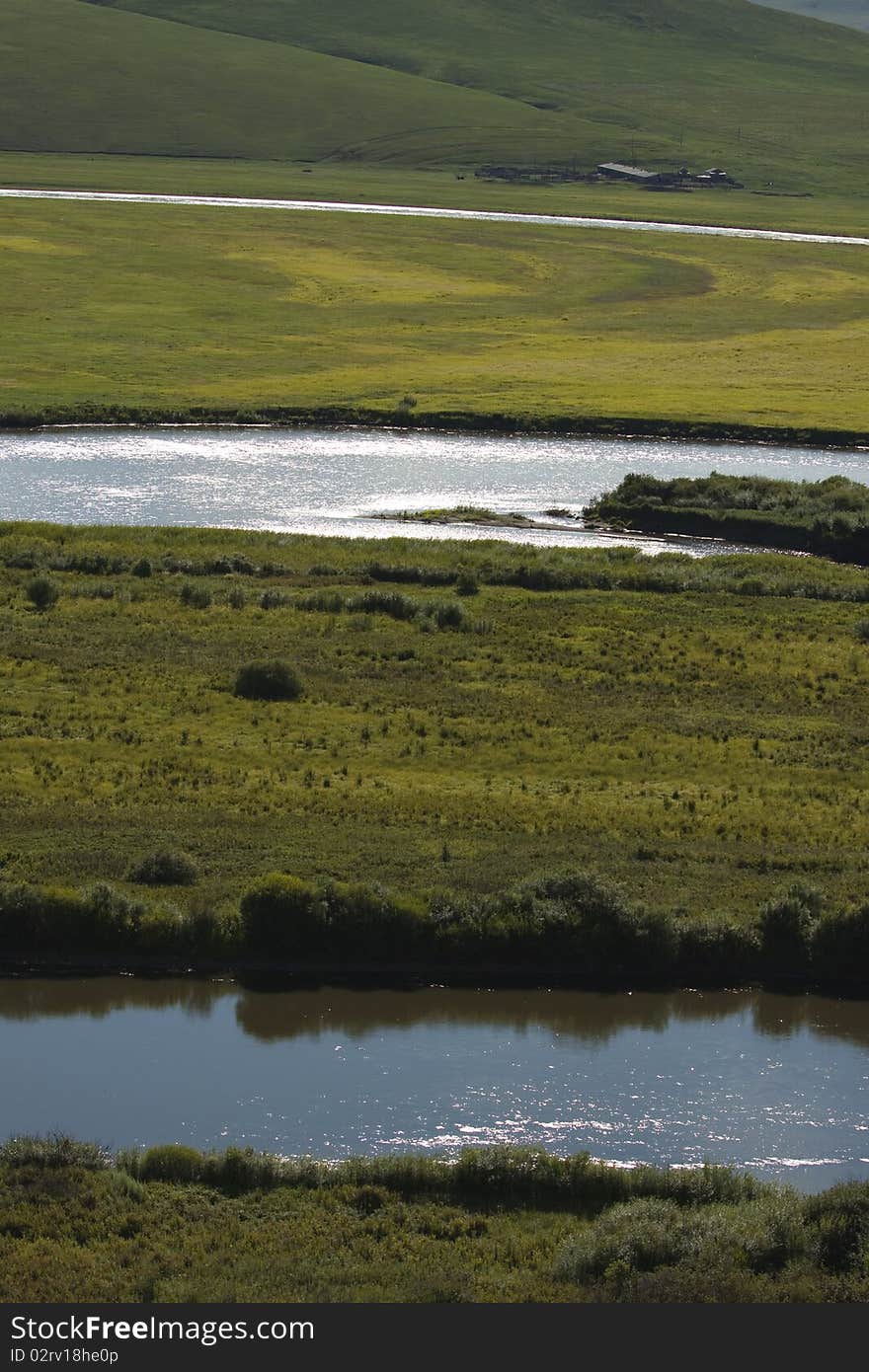 The river in the summer prairies of Inner Mongolia, China. The river in the summer prairies of Inner Mongolia, China