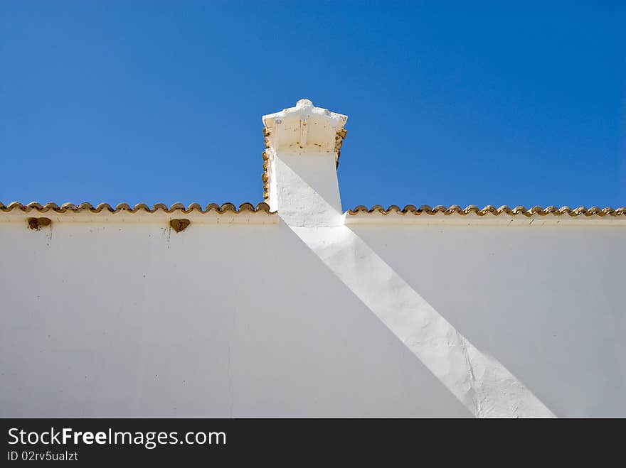 White wall under clear blue sky