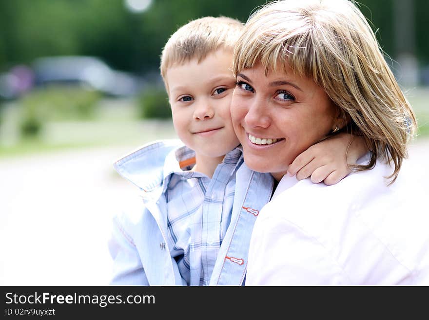 Happy mother and her little son outdoors session. Happy mother and her little son outdoors session