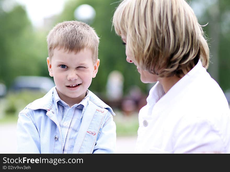 Happy mother and her little son outdoors session. Happy mother and her little son outdoors session