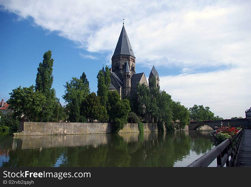 Church and river in the little town of Metz, France. Church and river in the little town of Metz, France.