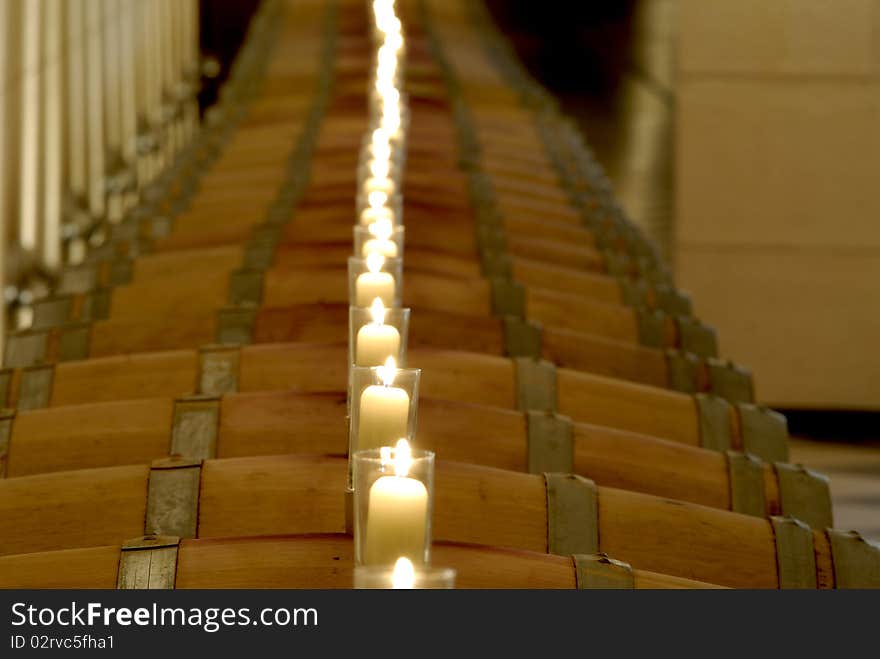 Barrels in rows with candles on top. Barrels in rows with candles on top