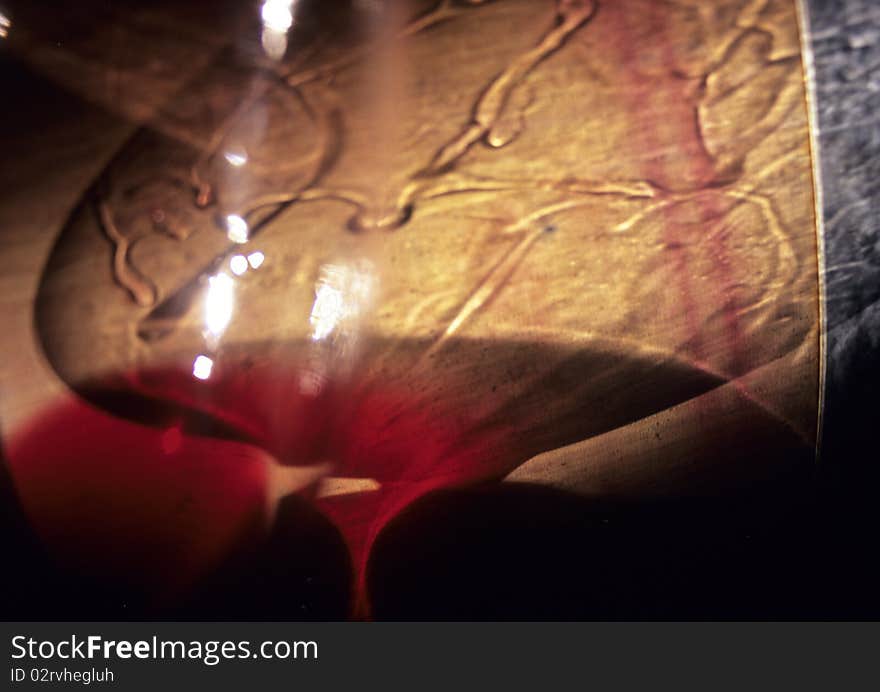 Reflection of light in a red wine glass