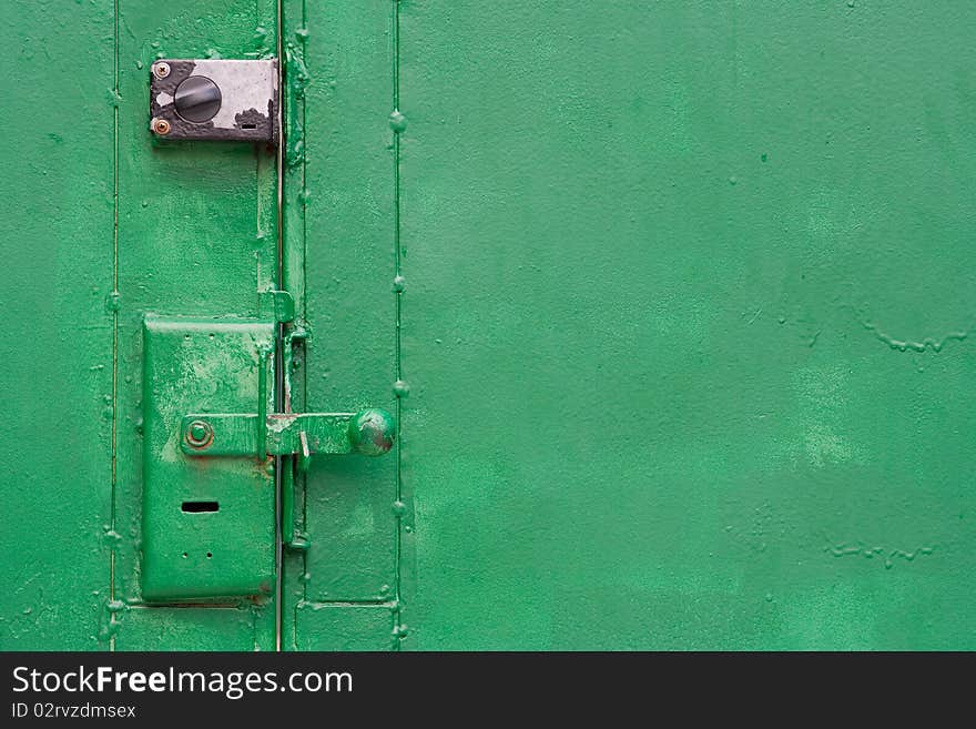 Door lock on the valve metal gate. Texture, background. Door lock on the valve metal gate. Texture, background