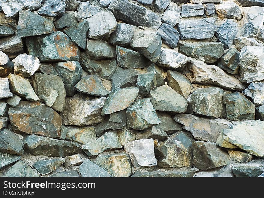 Wall of natural stone, background