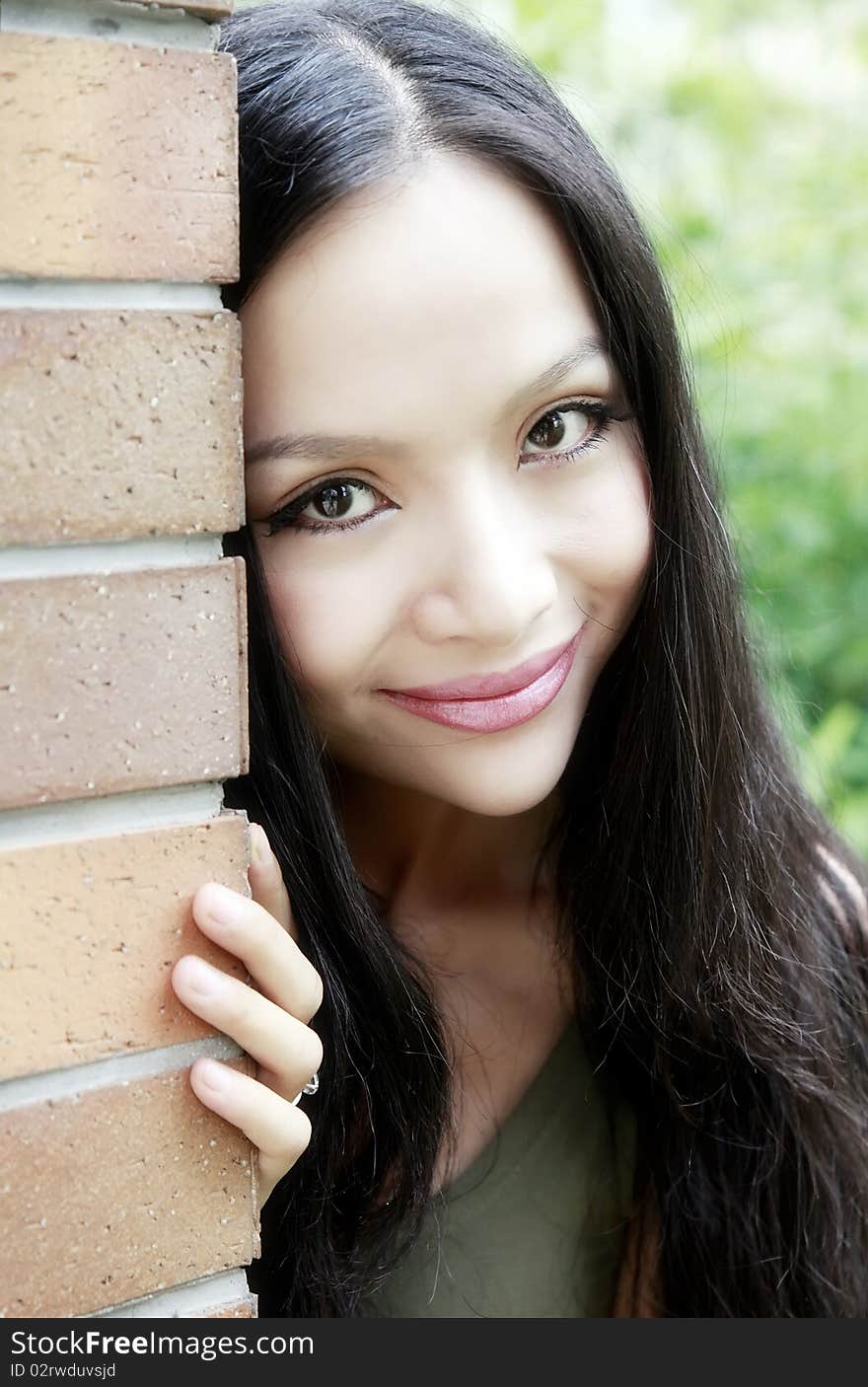 Beautiful Chinese girl smiling in summer.She is a professional model. Beautiful Chinese girl smiling in summer.She is a professional model.