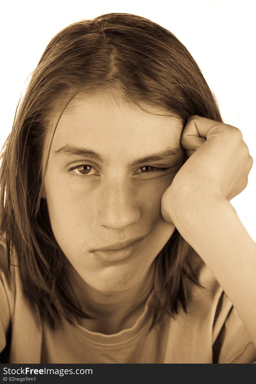 Monochrome portrait of a attractive sad teenager with shaggy hair, head rest on hand. selective focus. Monochrome portrait of a attractive sad teenager with shaggy hair, head rest on hand. selective focus.