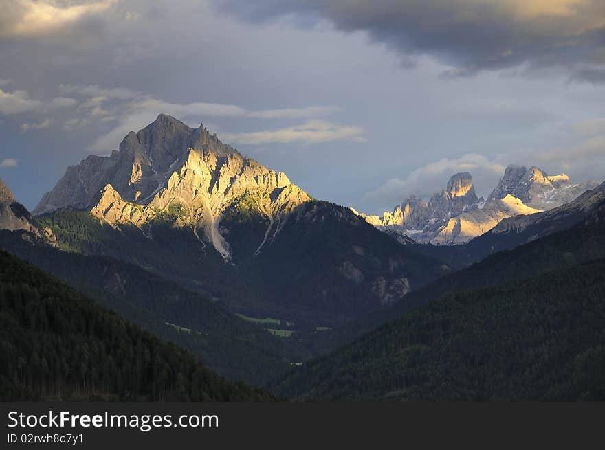 A ray of sun says goodbye to a Mountain into Italian Dolomites. A ray of sun says goodbye to a Mountain into Italian Dolomites