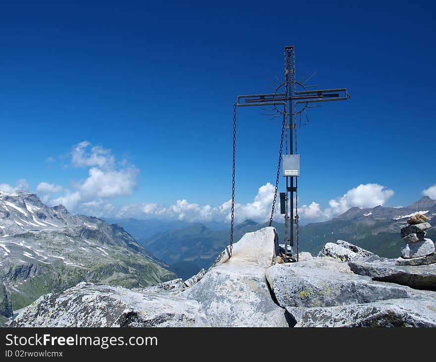 Cross standing on top of one of the alpine mountains. Cross standing on top of one of the alpine mountains