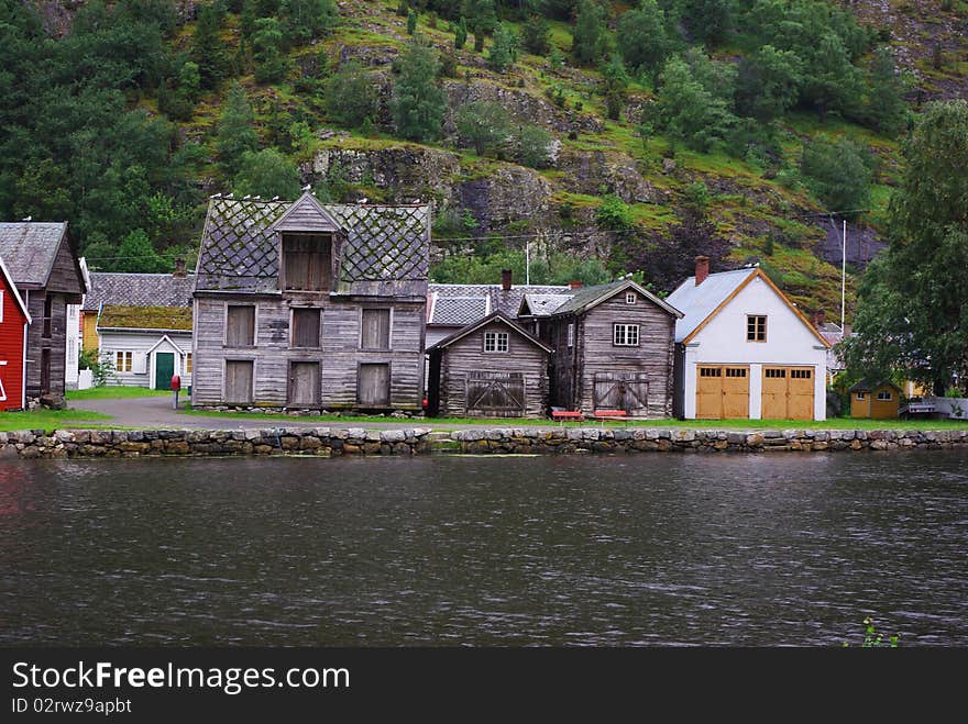 Traditional wooden houses on hillside background in Lyrdal, Norway. Traditional wooden houses on hillside background in Lyrdal, Norway