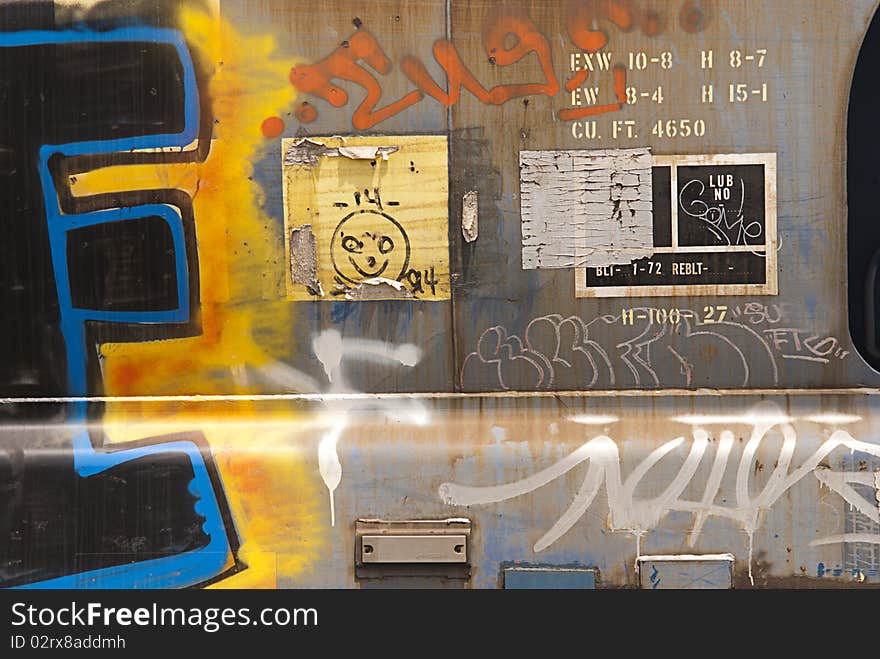 Close-up of metal panels on railroad wagon covered in graffiti. Close-up of metal panels on railroad wagon covered in graffiti