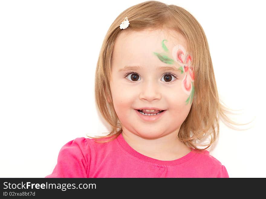 Smiling little girl with face-art isolated on white