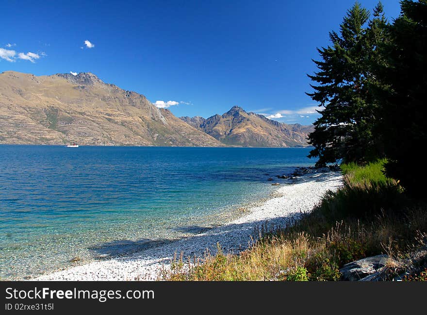 Shores of beautiful Lake Wakatipu in Queenstown, New Zealand