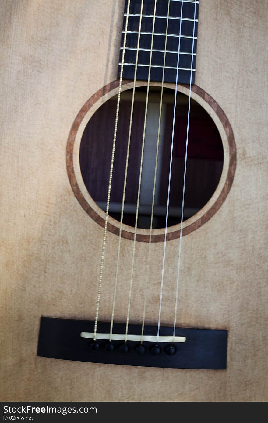 This is an acoustic guitar bridge and sound hole