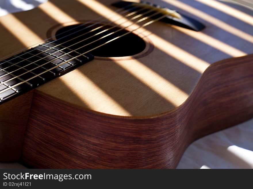 Guitar Detail Under Slatted Light