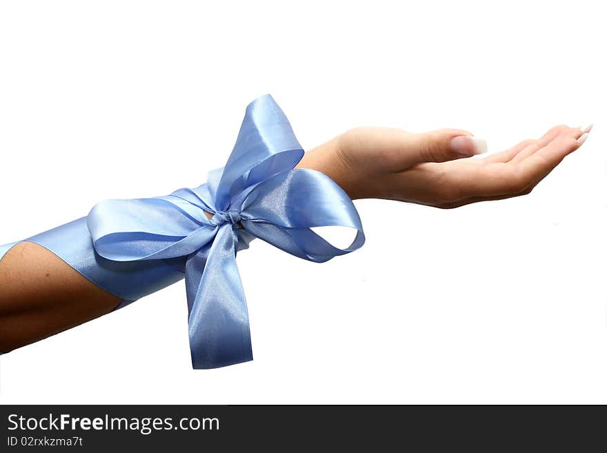 Female hand with a bow on a white background