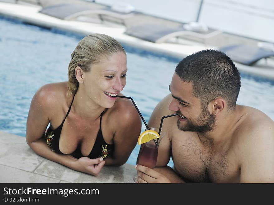 Happy Cople Relaxing  At Swimming Pool