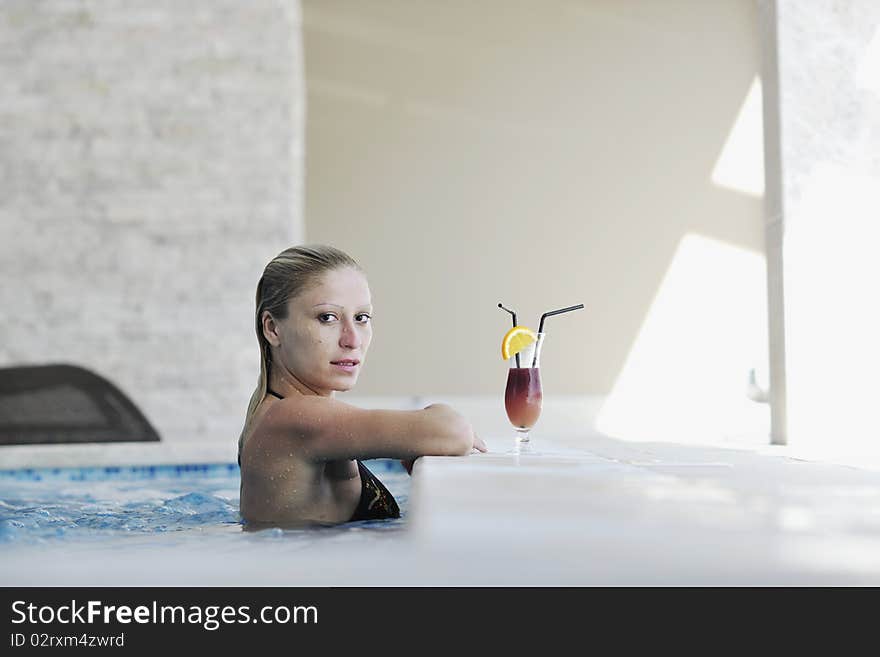 Beautiful young woman enjoy sun and coctail dring relaxing and have fun at siwmming pool. Beautiful young woman enjoy sun and coctail dring relaxing and have fun at siwmming pool