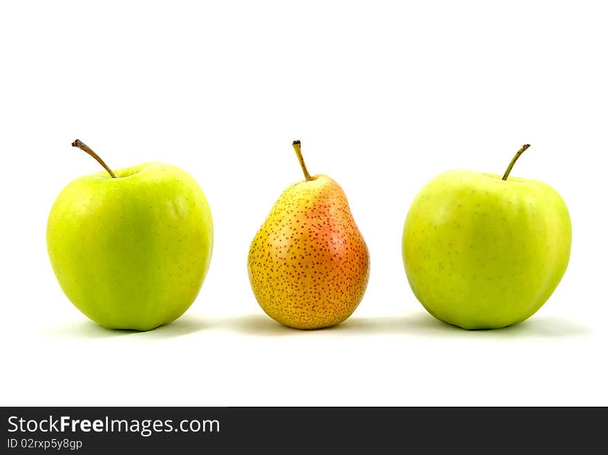 Green apples with the pear standing out from the crowd - over a white background. Green apples with the pear standing out from the crowd - over a white background