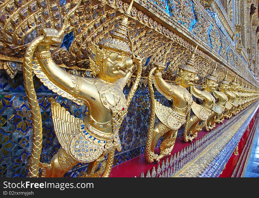 Thailand. The Grand Palace. Temple of the Emerald Buddha. Gold ornamental patter statuettes.