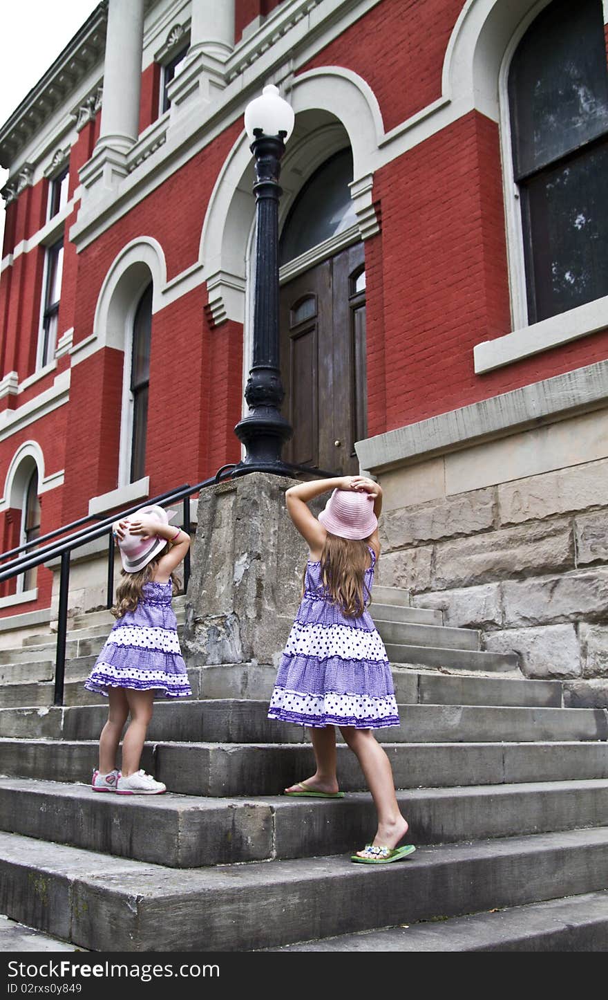 Sisters take an overwhelming view of the county courthouse. Sisters take an overwhelming view of the county courthouse