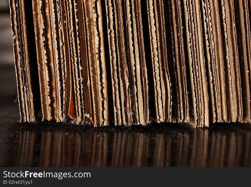 Cardboard stack on floor with reflection