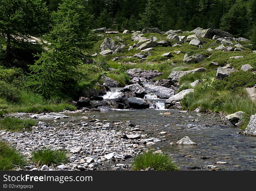 River by the mountain of the Aosta Valley. River by the mountain of the Aosta Valley.