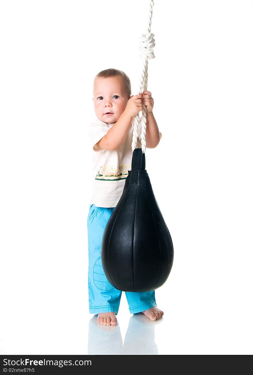 Little boy with the punching bag