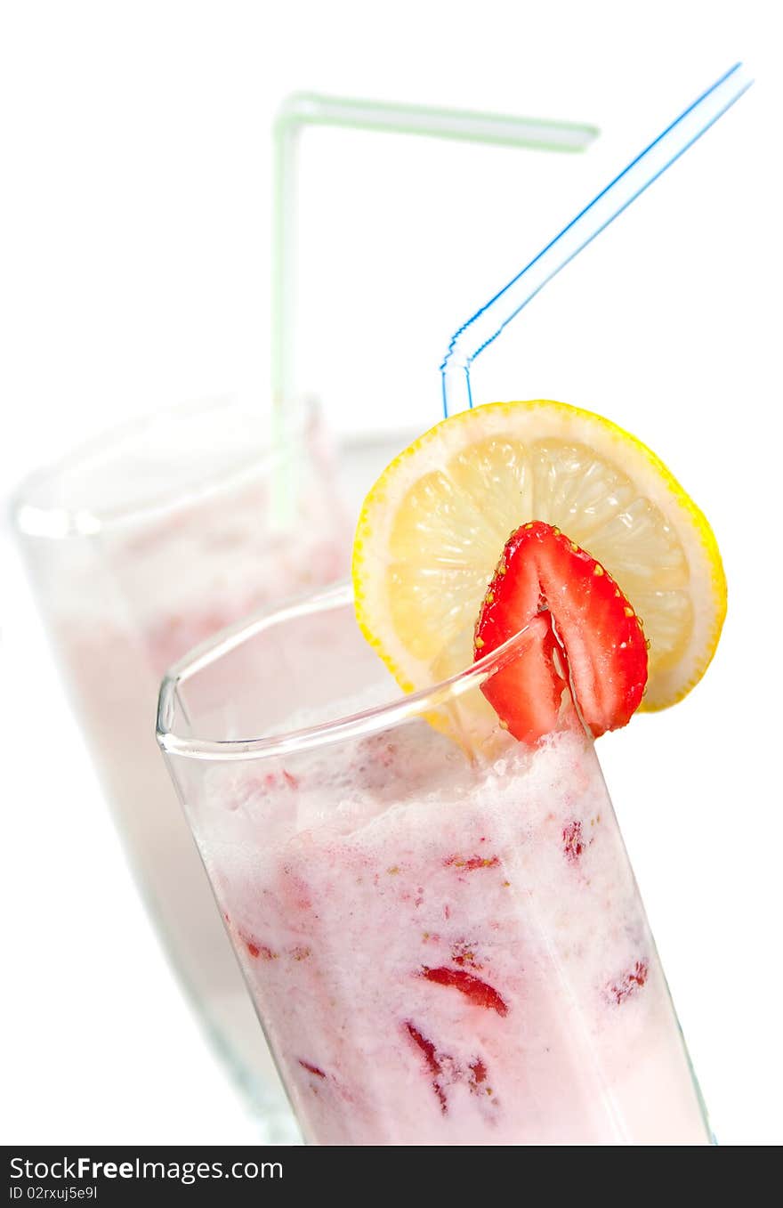 Milkshake with strawberries in a glass beaker. Milkshake with strawberries in a glass beaker