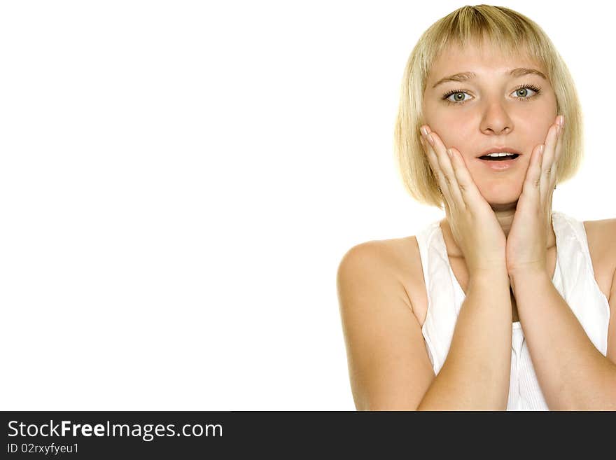 Close-up of a young woman looking surprised on white background