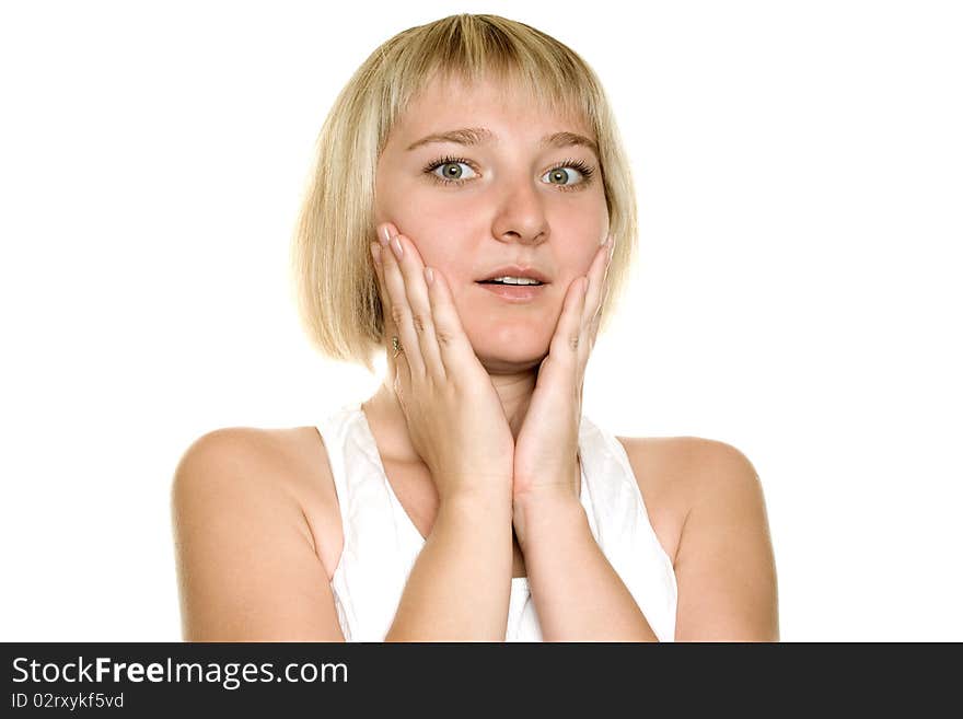 Close-up of a young woman looking surprised on white background