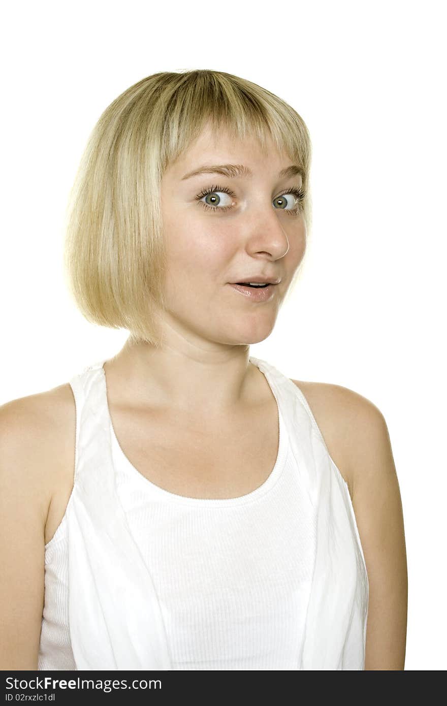 Close-up of a young woman looking surprised on white background