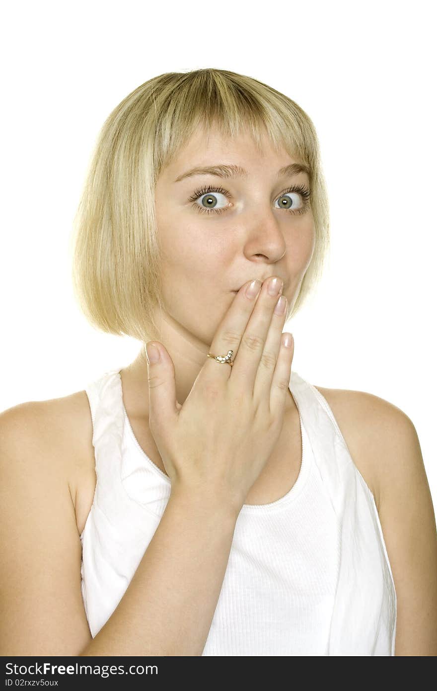 Close up young woman surprised covers mouth with his hand on a white background. Close up young woman surprised covers mouth with his hand on a white background